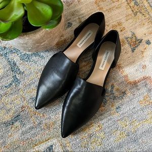 Black leather pointed toe loafers